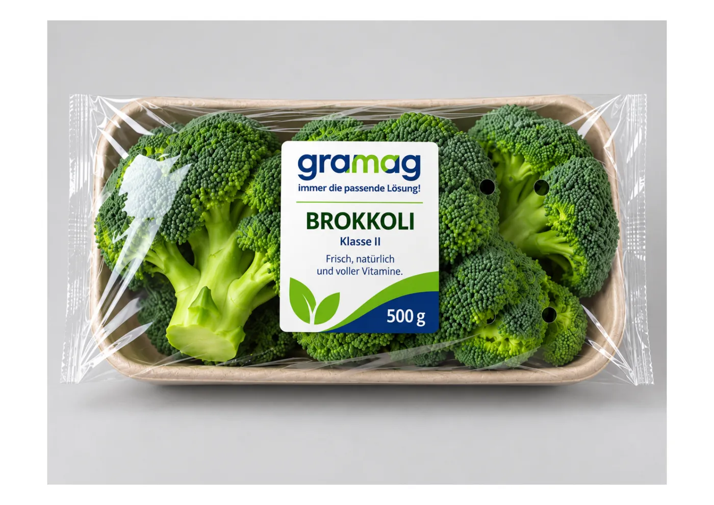 Brokkoli in Faserschale mit transparenter, belüfteter Flowpack-Umverpackung